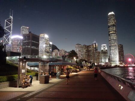 Waterfront Carnival Coming To Wan Chai With Drone Displays, Film Screenings & Food Stalls (Free Entry) a view of the Wan Chai Waterfront Water Sports and Recreation Theme Area by night