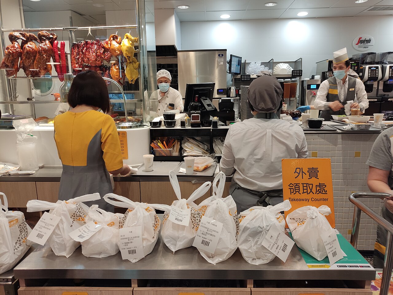 a restaurant kitchen with takeaway orders in hong kong