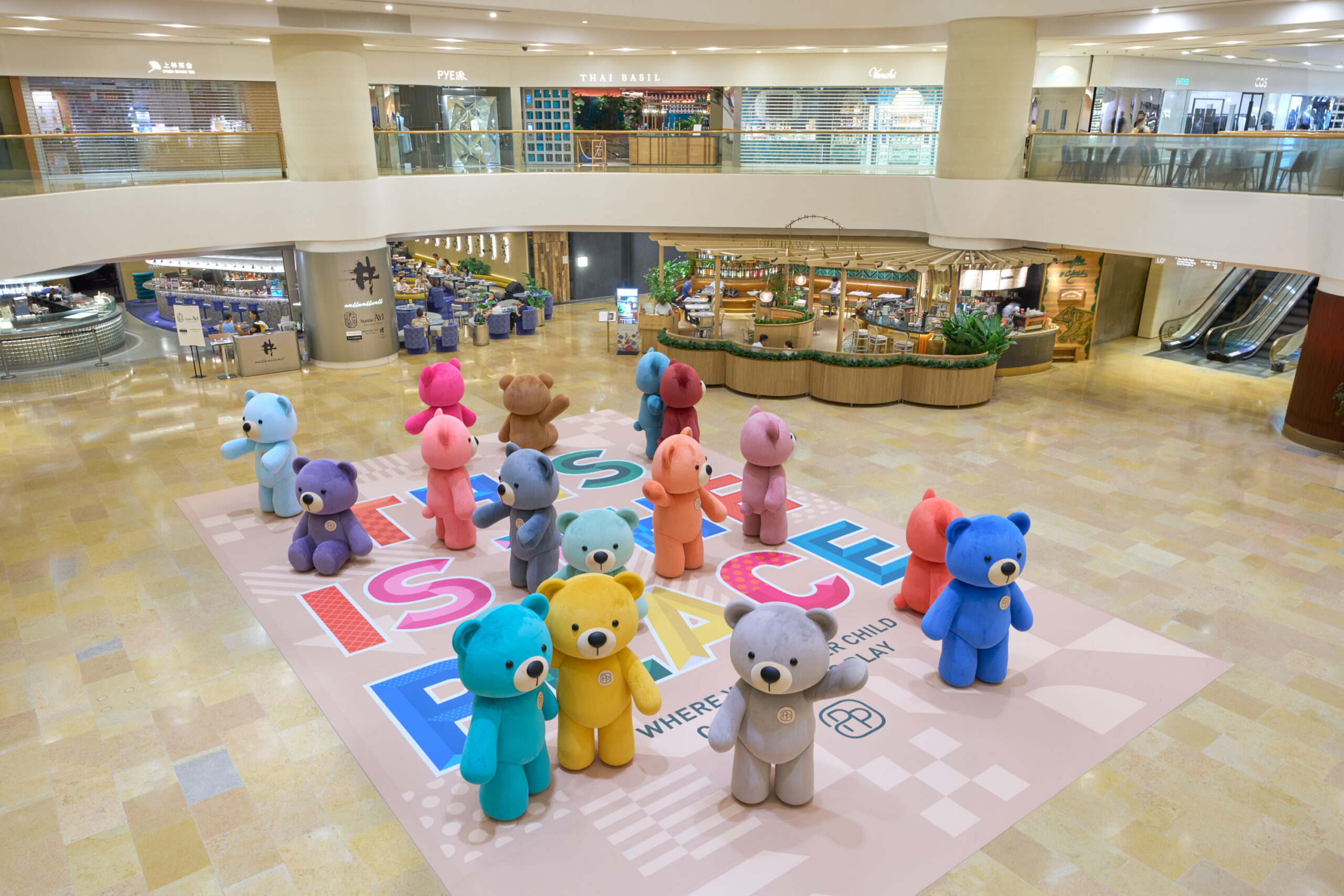 an overhead view of a group of bears standing in the garden court of pacific place