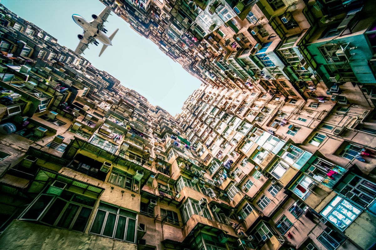 Airplane fly over monster building in Quarry Bay