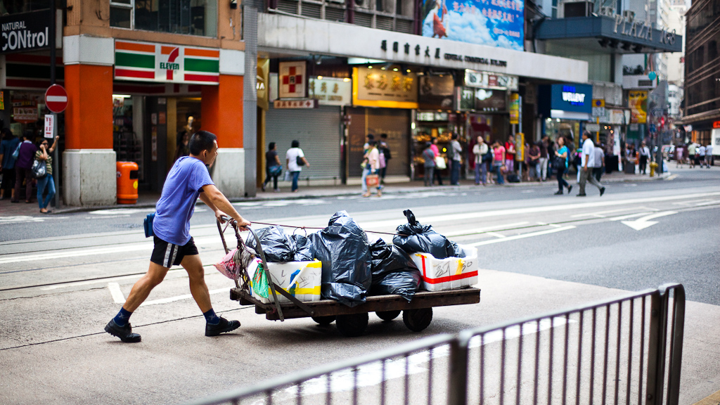hong kong worker collecting garbage
