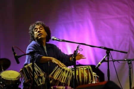 Grammy-Winning Tabla Player Zakir Hussain Will Perform in Hong Kong on June 6 zakir hussain performing on stage