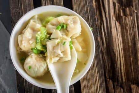 a bowl of wonton noodles in soup