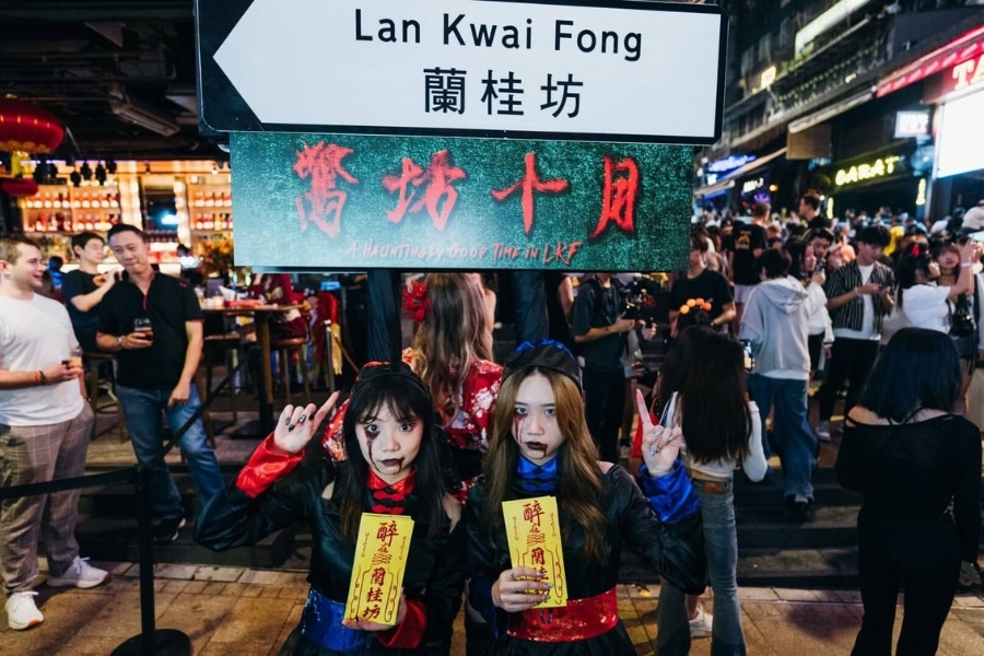 two girls dressed up as chinese zombies during halloween in lan kwai fong