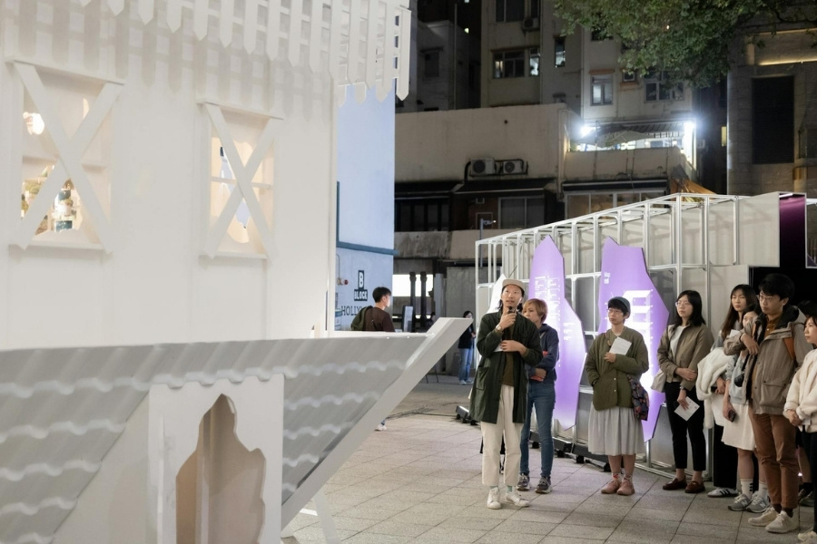 a curator guiding the exhibition tour at detour design festival