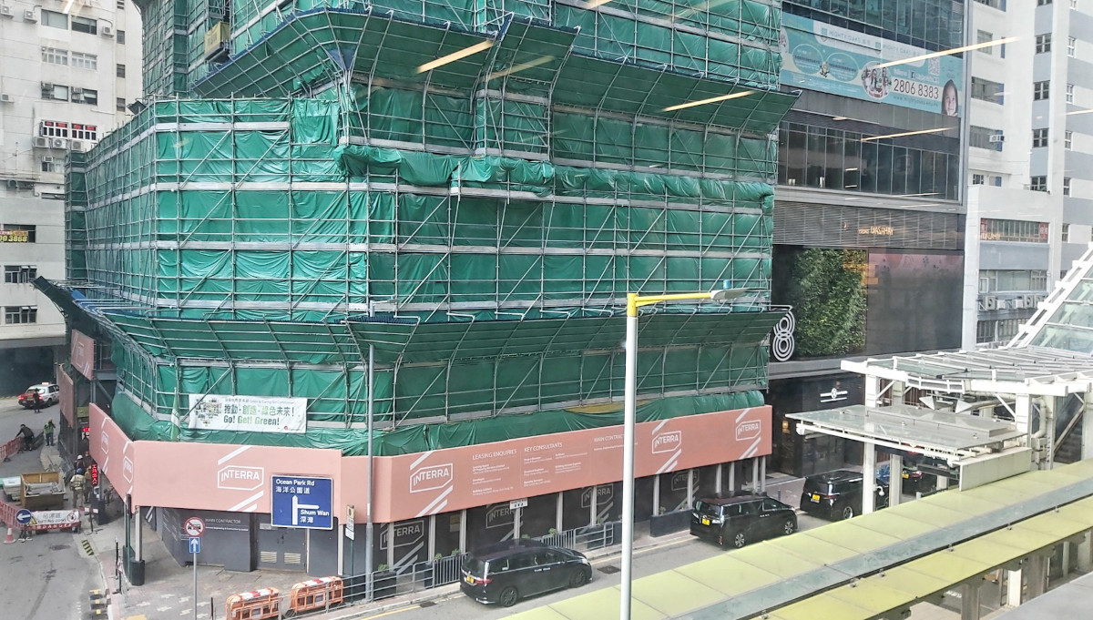 building under repair in wong chuk hang with netting