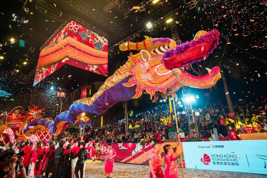 A large illuminated dragon dance winds through the crowd during Hong Kong’s Chinese New Year Night Parade in Tsim Sha Tsui