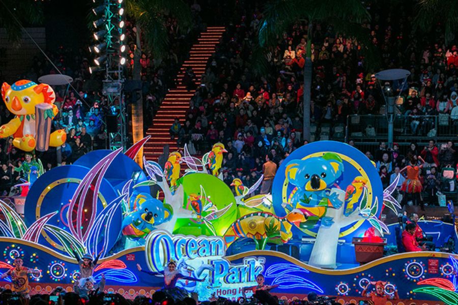Themed parade floats pass through packed streets as spectators watch the Chinese New Year Night Parade in Tsim Sha Tsui, Hong Kong