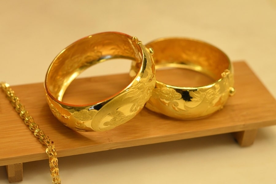 two gold bracelets