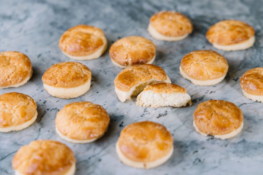 Mini pineapple bun cookies with classic crackled topping, arranged on a tray (The Forest Bakery+)