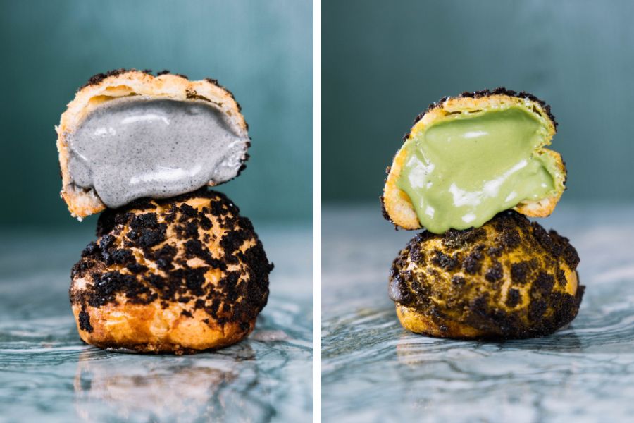 Black sesame and pistachio bolo bao puffs cut open, with dark and green custard centres (The Forest Bakery+)