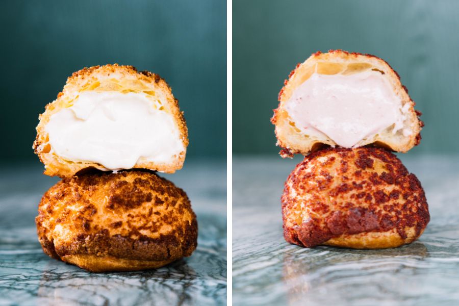 Vanilla and strawberry pineapple bun puffs cut open, showing creamy custard fillings (The Forest Bakery+)