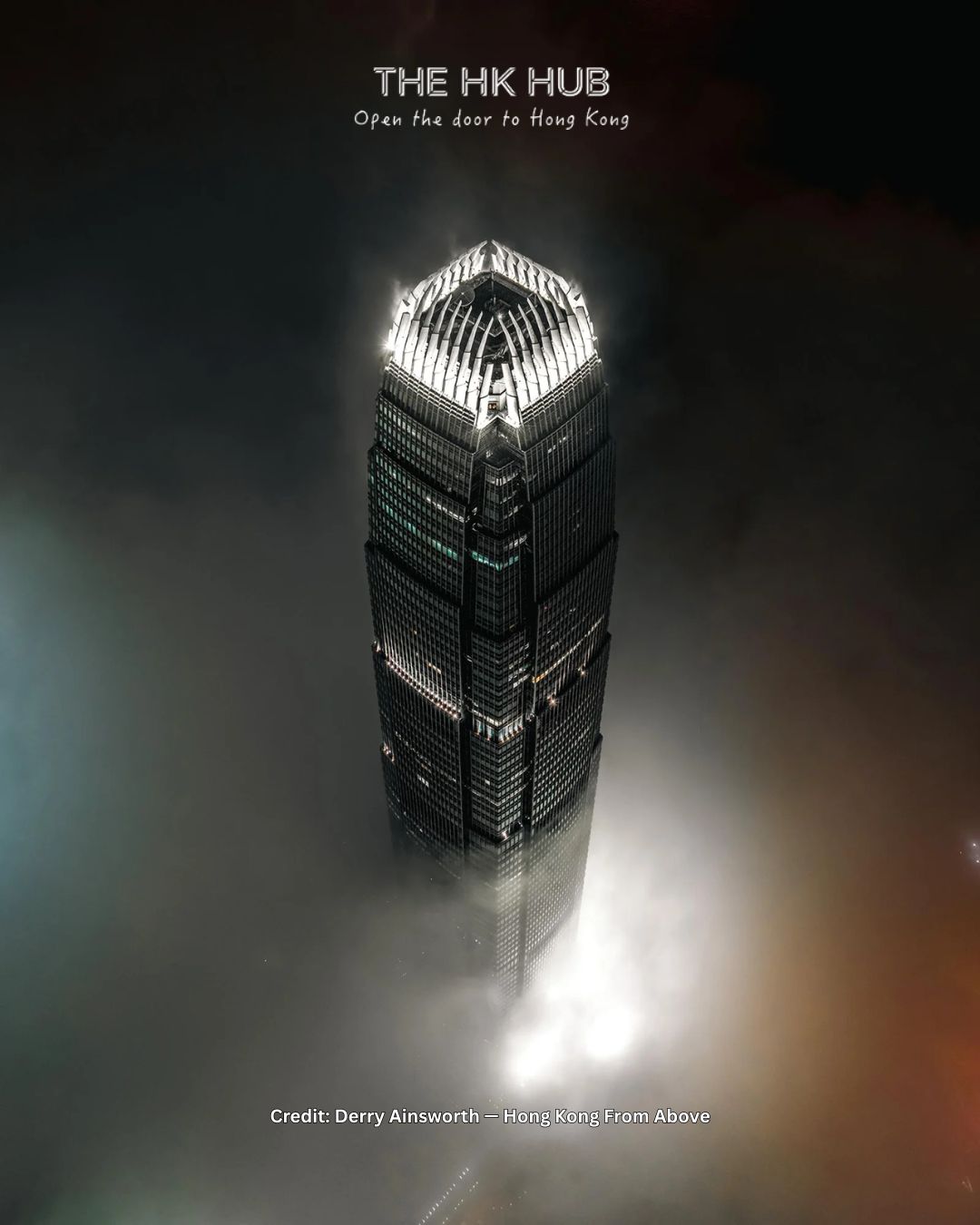 Hong Kong IFC rising through clouds at night (Derry Ainsworth)