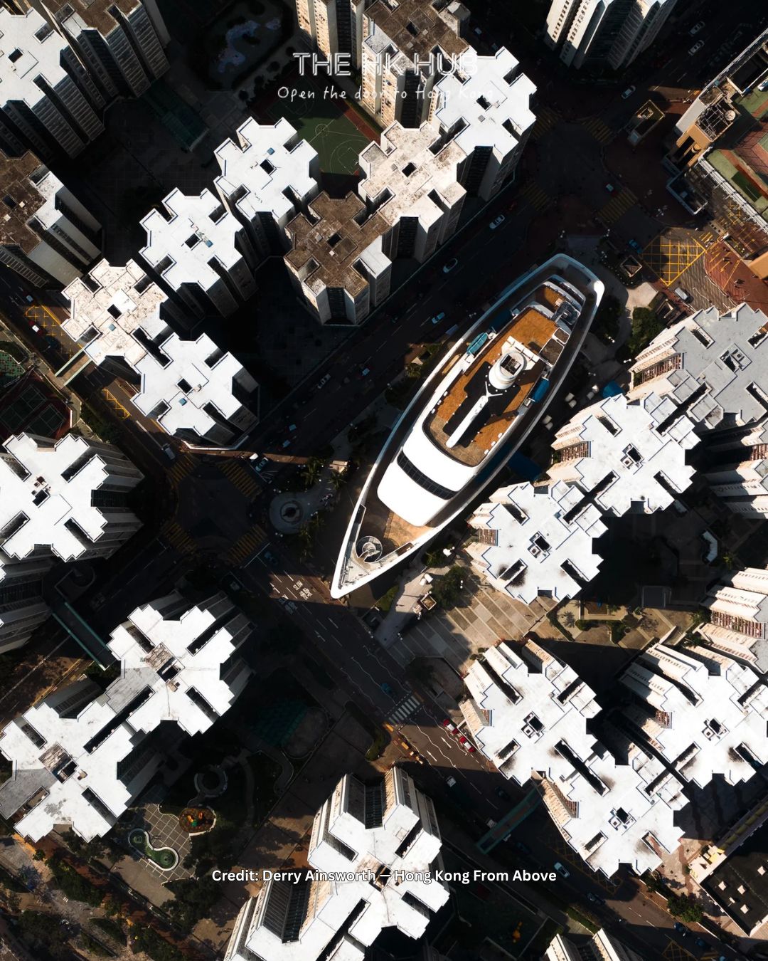 Whampoa boat surrounded by high-rise buildings in Hong Kong from above (Derry Ainsworth)