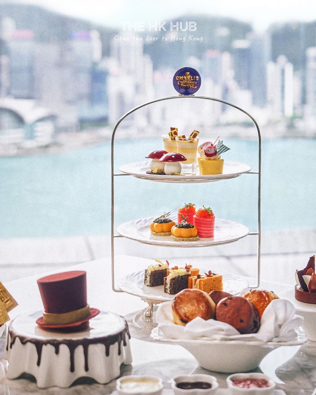 Charlie and the Chocolate Factory afternoon tea at Felix, with pastries and sandwiches overlooking Victoria Harbour (The Peninsula Hong Kong)